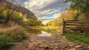 Scenic Autumn Landscape with Rustic Fence and Reflective Pond