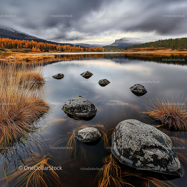 Tranquil Autumn Lake with Rocks and Reflective Waters