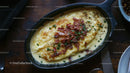 Creamy Mashed Potatoes with Bacon and Chives in Skillet