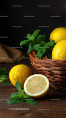 Fresh Lemons and Mint in Wicker Basket on Wooden Table