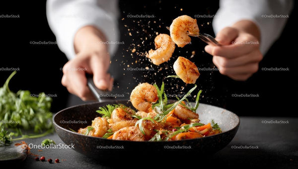 Chef Tossing Sizzling Shrimp with Fresh Ingredients