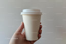 Hand Holding a Minimalist Paper Coffee Cup