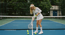 Female Tennis Player Practicing on Outdoor Court