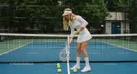 Female Tennis Player Practicing on Outdoor Court