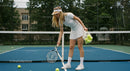 Female Tennis Player Setting Up for Practice on Outdoor Court