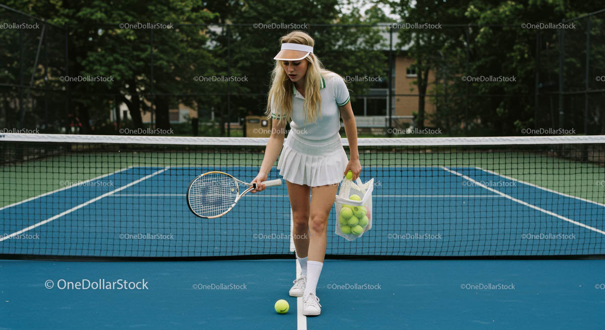 Female Tennis Player Practicing on Blue Court