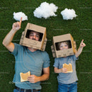 Father and Son in Cardboard Helmets Enjoy Imaginative Play
