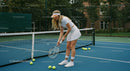 Young Woman Practicing Tennis on Outdoor Court