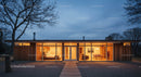 Modern Glass House Illuminated at Twilight with Cozy Interiors