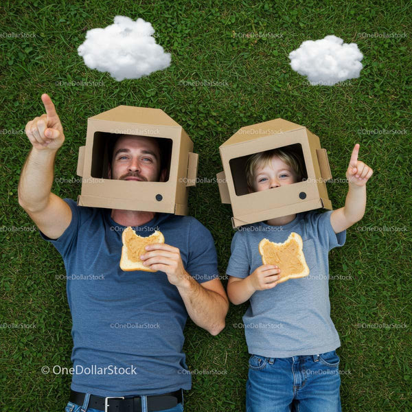 Father and Son Pretending to Be Astronauts on Grass