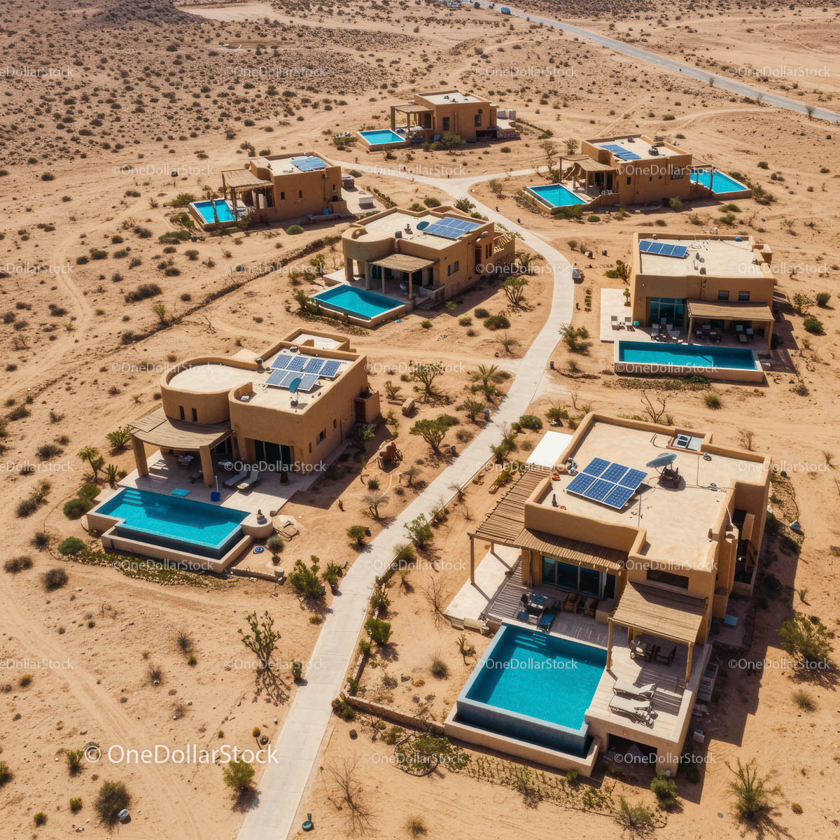 Aerial View of Luxurious Desert Villas with Pools and Solar Panels