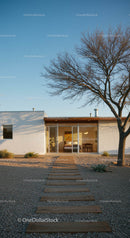 Modern Desert Home with Clear Blue Sky and Wooden Path