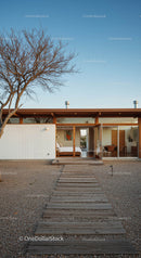 Modern Desert Home with Open Glass Doors and Wooden Pathway