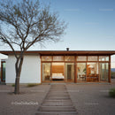 Modern Desert Home with Glass Facade and Wooden Accents