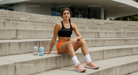 Athletic Woman Relaxing on Urban Steps in Sportswear