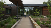 Woman Walking Toward Modern Wooden House with Garden