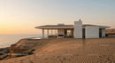 Modern Beachfront House at Sunset in Desert Landscape
