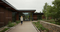 Modern Office Building with Wooden Exterior and Lush Garden