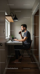 Man Working from Home Office with Laptop and Coffee