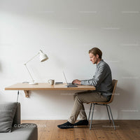 Minimalist Home Office with Man Working on Laptop