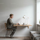 Man Working in Minimalist Home Office with Laptop