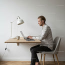 Young Professional Working at Minimalist Home Office Desk