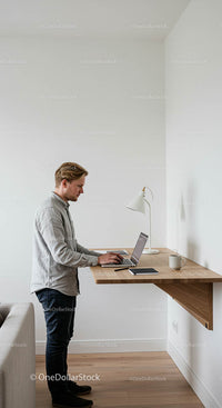 Professional Working at a Minimalist Standing Desk