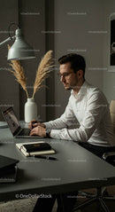 Professional Man Working with Laptop in Modern Office