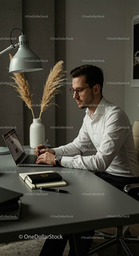 Professional Man Working with Laptop in Modern Office