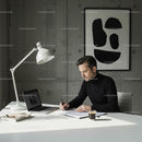 Businessman Focused on Work in a Modern, Minimalist Office
