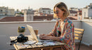 Young Woman Working Remotely on a Rooftop Terrace