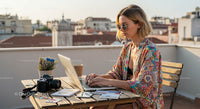 Young Woman Working Remotely on a Rooftop Terrace