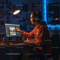 Young Graphic Designer Working Late at Modern Studio