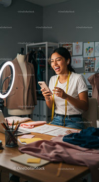 Smiling Fashion Designer in Modern Creative Studio