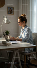 Woman Working on Laptop in a Cozy Home Office
