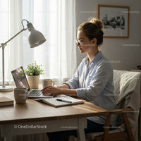 Woman Working on Laptop in Bright Home Office
