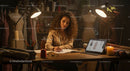 Fashion Designer Sketching in Cozy Studio at Night