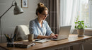 Woman Working on Laptop in Cozy Home Office