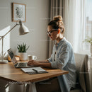 Focused Woman Working Remotely in Sunlit Home Office
