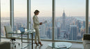 Elegant Woman in Modern Office Overlooking City Skyline