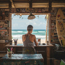Digital Nomad Working at Island Beachfront Desk