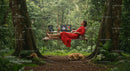 Woman Relaxing on Tree Swing with Laptops in Forest