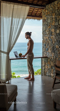 Man Working Remotely with Ocean View in Tropical Setting