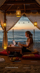 Freelancer Working in a Beachside Gazebo at Sunset