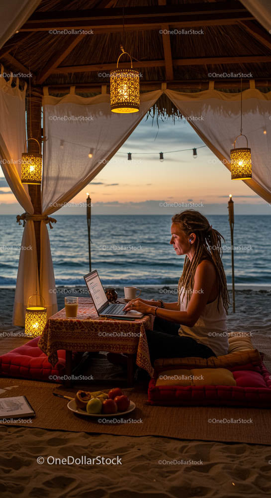 Freelancer pracujący w altanie przy plaży o zachodzie słońca