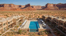 Desert Resort with Pool and Sandstone Cliffs in Background