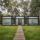 Modern Glass Building in Forest with Wooden Pathway