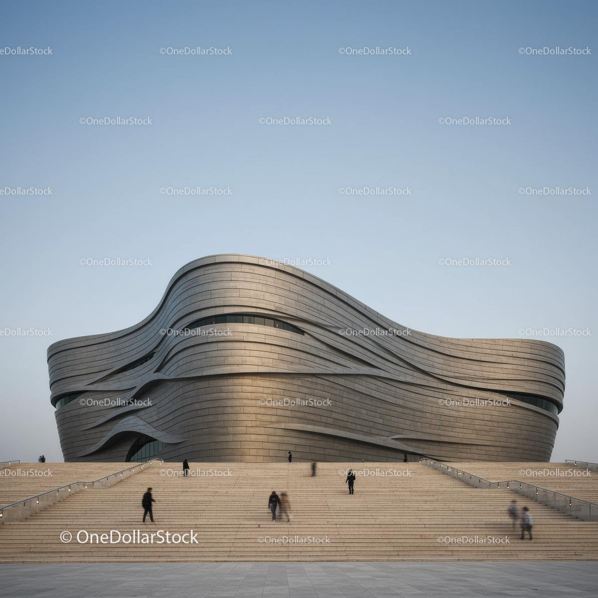 Futuristic Curved Building Against Clear Sky