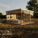Modern Glass House in a Serene Natural Setting at Sunset