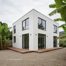Contemporary White House with Banana Plants and Wooden Deck